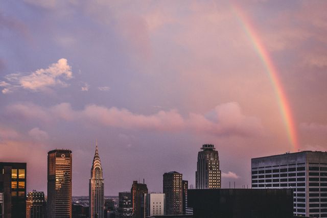 Urban Skyline with Rainbow at Sunset - Download Free Stock Photos Pikwizard.com