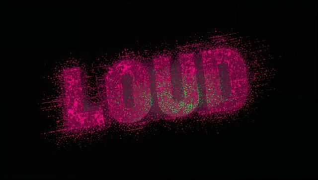 Loud typography rotating with scattered magenta particles and neon green speckles