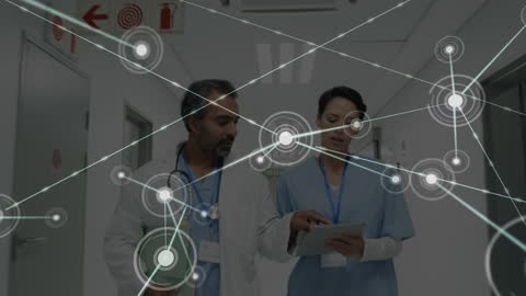 Doctors Discussing Healthcare Technology in Hospital