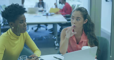 Diverse Businesswomen Discussing Data with Overlay