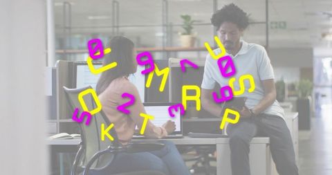 Collaborating colleagues leaning over laptop in modern open office with neon doodles