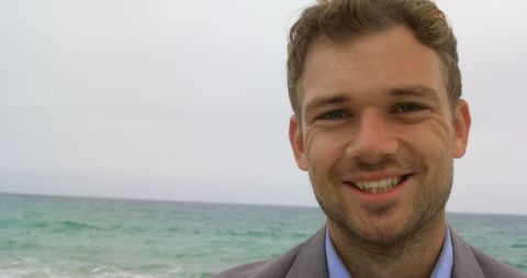 Smiling Businessman Enjoying Beach
