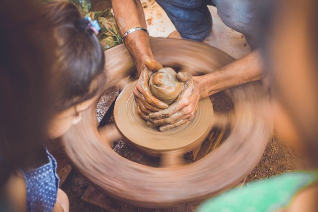 Hands Crafting Pottery on Spinning Wheel - Download Free Stock Images Pikwizard.com