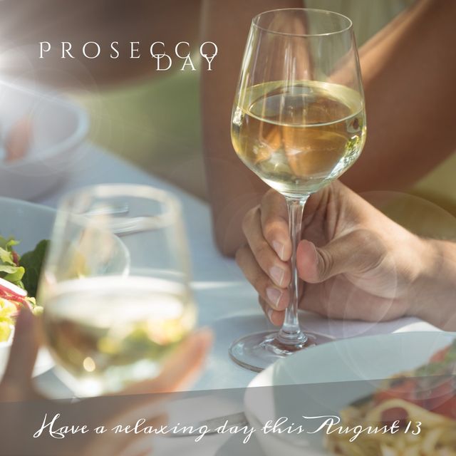 Digital composite image of cropped hands holding wineglasses with prosecco day text at lunch party. Sparkling wine, summer, celebration, enjoyment, holiday, national prosecco day.