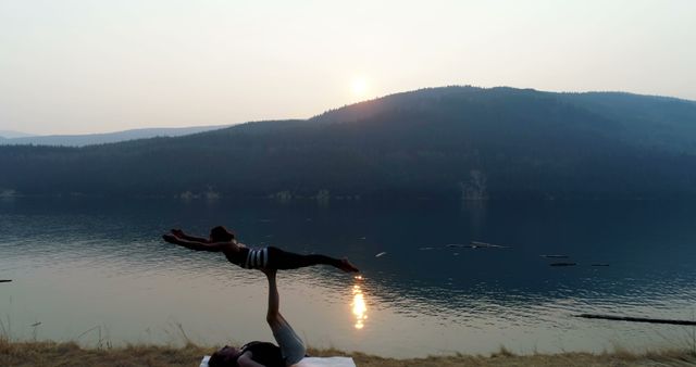 Couple Practicing Acro Yoga on Lakeside During Sunset - Download Free Stock Images Pikwizard.com