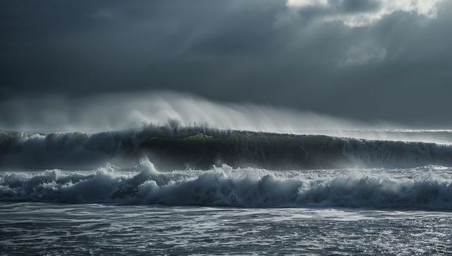 Majestic ocean waves under stormy skies