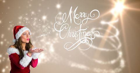 Joyful Woman in Santa Hat Blowing Christmas Greetings - Download Free Stock Templates Pikwizard.com