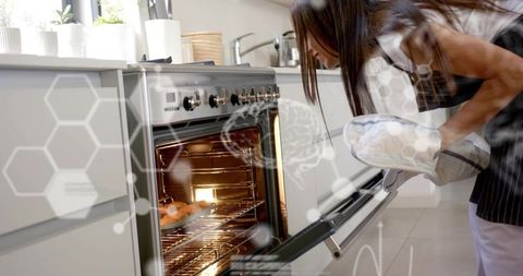 Teen leaning over oven checking muffins with oven mitt and apron, augmented hud overlay
