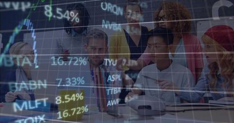 Diverse team collaborating around laptop with market data overlay for strategy session