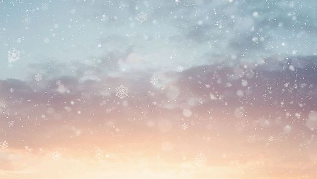 Pastel sunrise with drifting snowflakes, soft bokeh and dreamy cloud band