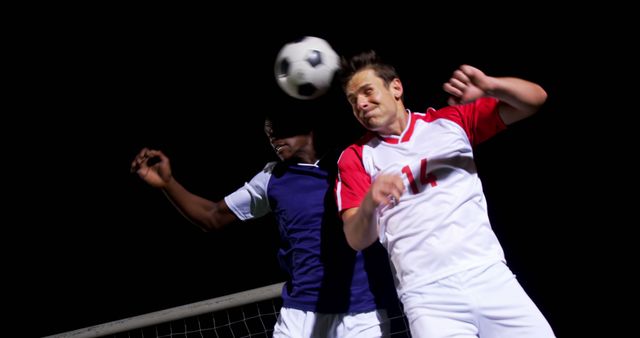 Soccer Players Fighting for Ball During Night Game - Download Free Stock Images Pikwizard.com