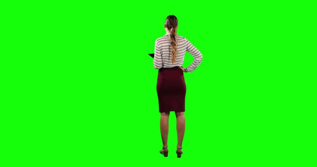 Confident Businesswoman in Formal Attire Working on Tablet with Green Screen Background - Download Free Stock Images Pikwizard.com