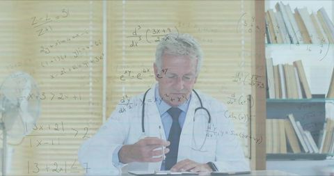 Experienced doctor writing notes with medical equations overlay