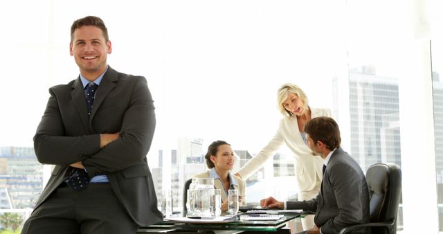 Confident Businessman Standing by Team Collaborating in Modern Office - Download Free Stock Images Pikwizard.com