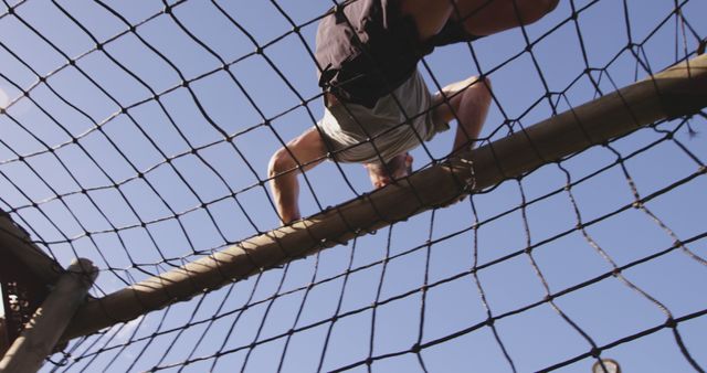 Man Climbing Barrier Net During Obstacle Course Race - Download Free Stock Images Pikwizard.com