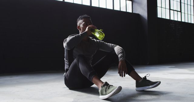 Fitness Enthusiast Hydrating While Resting in Gym - Download Free Stock Images Pikwizard.com