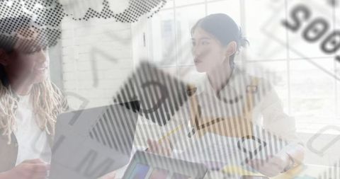 Colleagues Discussing Data Overlayed with Financial Charts