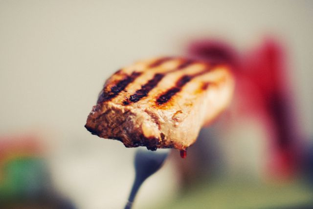 Close-up Grilled Whole Steak With Grill Marks on Fork - Download Free Stock Images Pikwizard.com