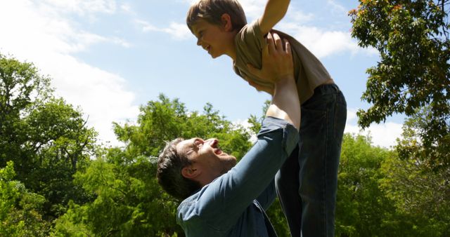 Father Lifting Son Outdoors on Sunny Day - Download Free Stock Images Pikwizard.com