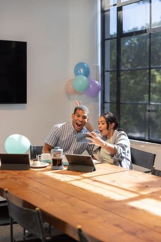 Diverse Coworkers Taking Selfie in Office Celebration Scene