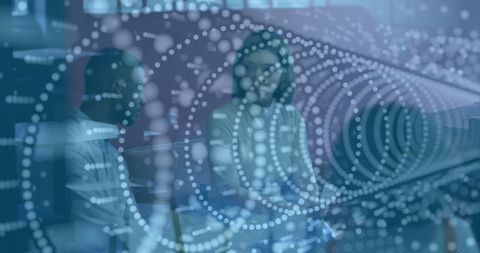 Colleagues Discussing Strategy with Data Visualization in Modern Office