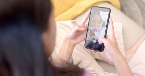 Teen Capturing Cake on Smartphone Indoors