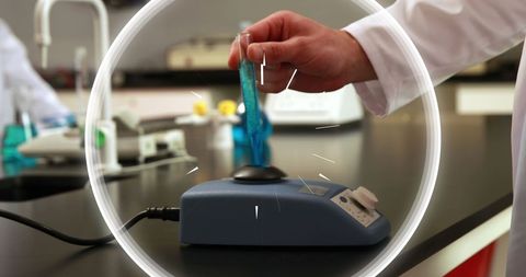 Scientist Analyzing Sample with Instrument in Laboratory