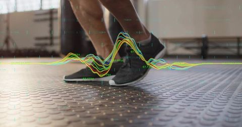 Male performing dynamic footwork with biometric waveform overlay for fitness tracking