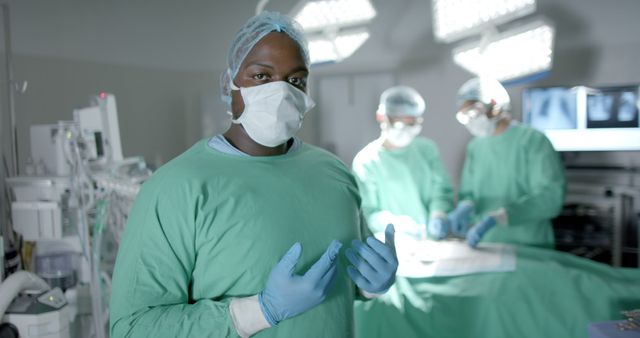 Confident Surgeon in Operating Room with Team During Surgery - Download Free Stock Images Pikwizard.com