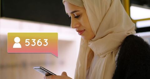 Muslim Woman in Hijab Engaging on Social Media