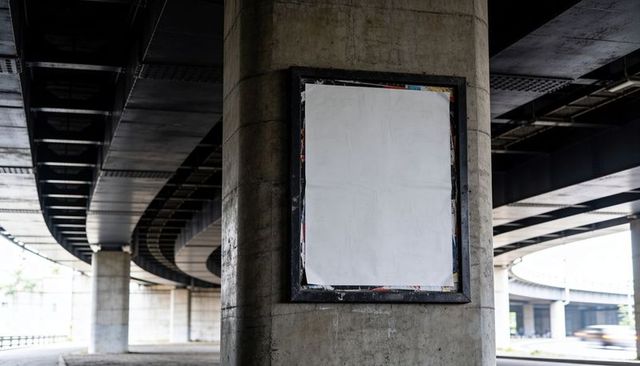 Blank Poster on Concrete Pillar under Urban Overpass with Curved Elevated Highway Lines