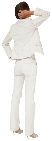 Hispanic businesswoman is thoughtful, facing away while wearing stylish white suit. Can be used in business presentations, diverse workplace promotions, fashion editorials, or relevant design projects highlighting workforce diversity and formal attire.