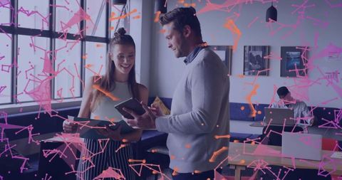 Team collaboration with digital tablet in coworking space