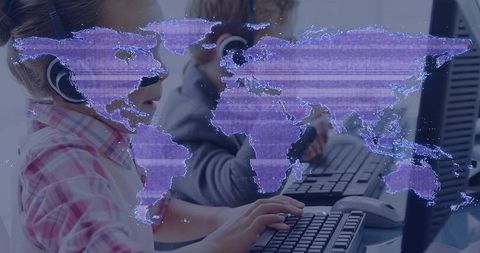 Children typing at computer workstations with holographic purple world map overlay