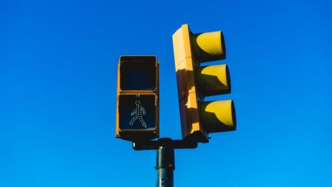 Urban Crosswalk Signal under Clear Blue Sky