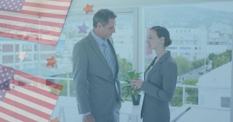 Business colleagues discussing strategy in urban office with american flag graphic overlay