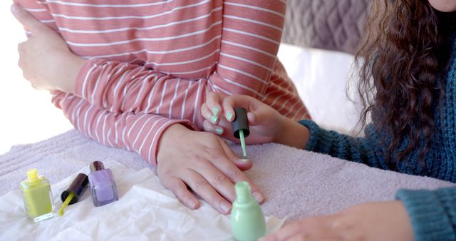 Friends Painting Nails with Pastel Nail Polish at Home - Download Free Stock Images Pikwizard.com