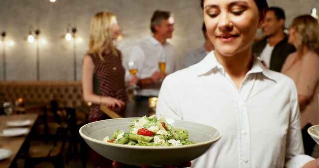 Waitress Serving Pasta in Elegant Restaurant with Smiling Guests - Download Free Stock Images Pikwizard.com