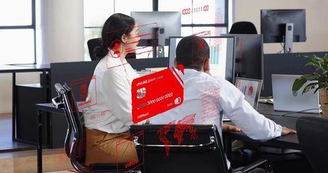 Office team reviewing cybersecurity threats with holographic red alerts and data overlays