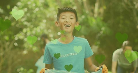 Smiling Volunteer Collecting Trash with Heart Icons Overlay