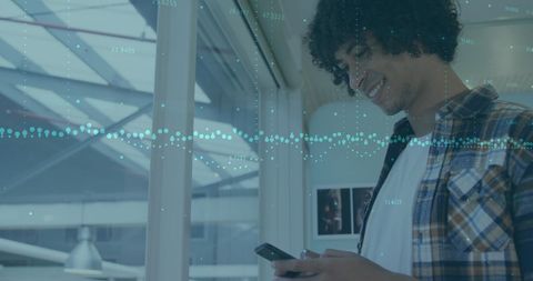 Smiling Man Analyzing Data on Smartphone with Dynamic Digital Overlay