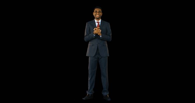 Confident Businessman Smiling in Dark Studio Background - Download Free Stock Images Pikwizard.com