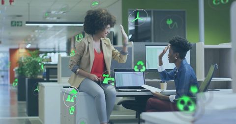 Eco-Friendly Team Celebrating Success in Modern Office Space