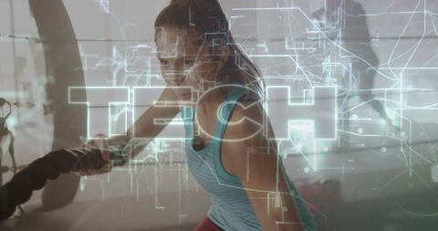 Female Athlete Pulling Battle Rope with Futuristic Tech HUD Overlay, Power and Focus
