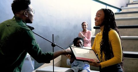 Woman Receiving Award during Corporate Seminar in Office Setting - Download Free Stock Images Pikwizard.com