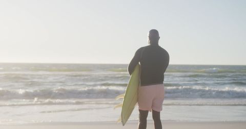 Senior Surfer Holding Surfboard on Sunny Beach - Download Free Stock Images Pikwizard.com
