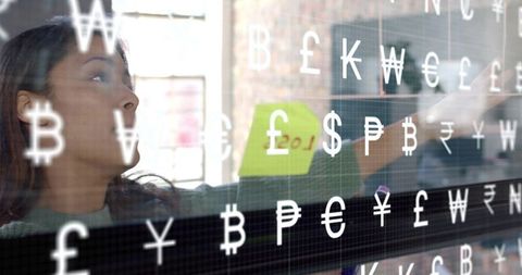 Businesswoman Analyzing Currency Market Trends in Modern Office