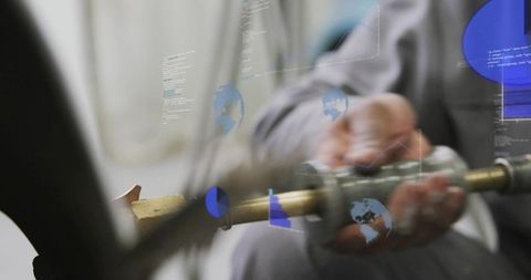 Technician inspecting brass tube coupling with augmented reality overlays for precision