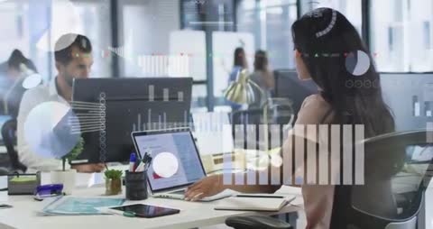 Business Professionals Analyzing Data with Digital Displays