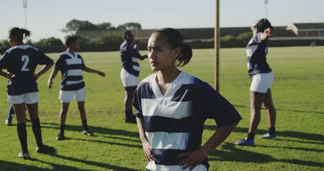 Determined Female Rugby Player on Field During Team Practice - Download Free Stock Images Pikwizard.com